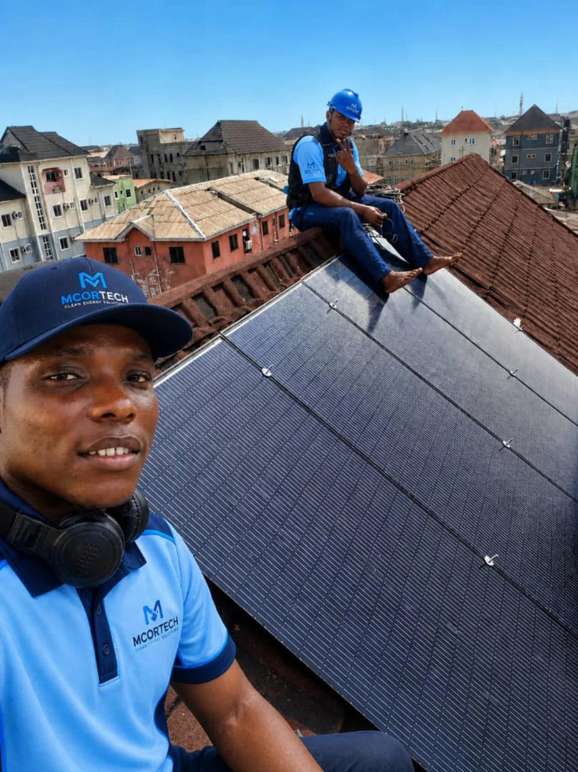 MCORTECH technicians working on a rooftop solar installation